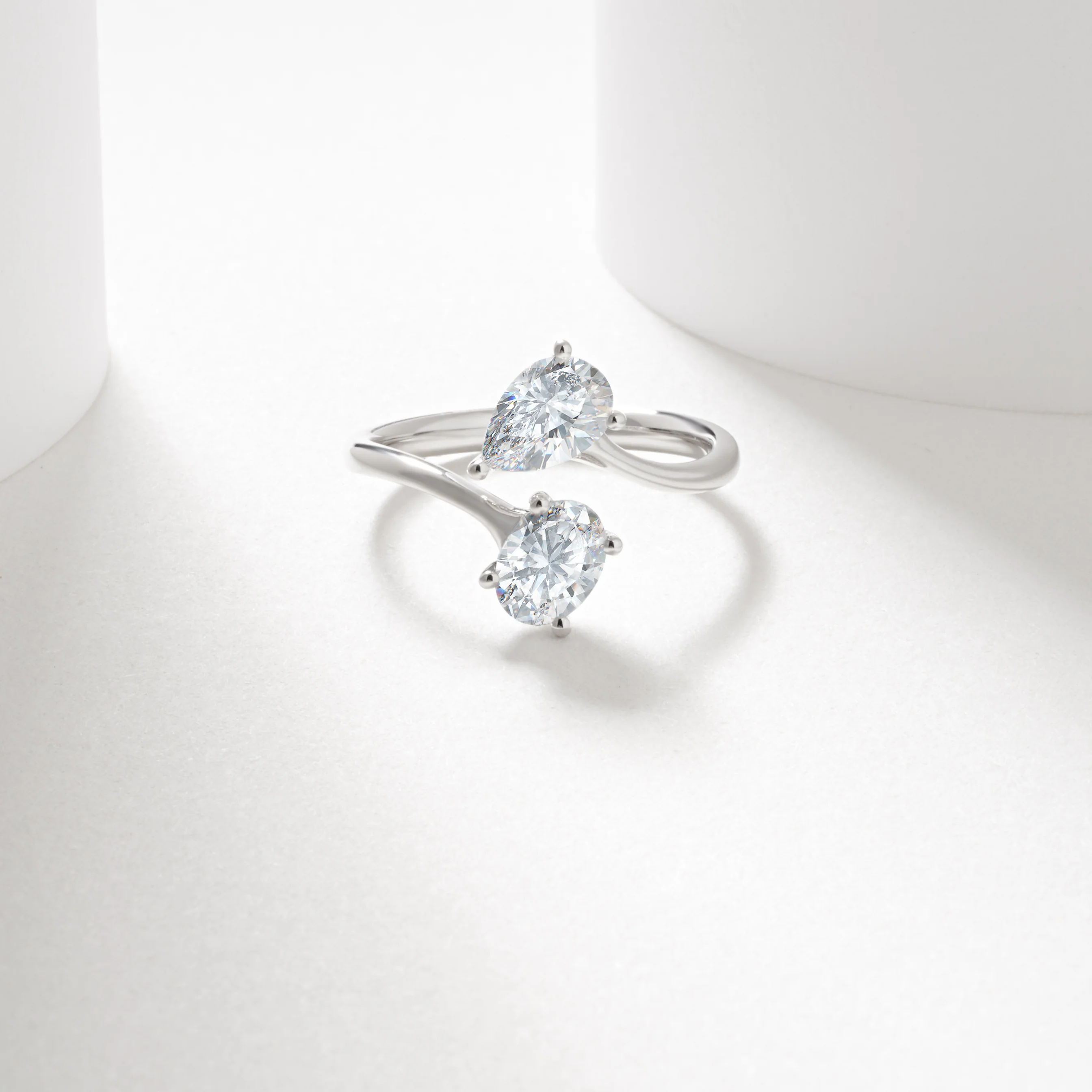 9w 0.7ct oval and pear cut lab diamond claw set toi et moi ring