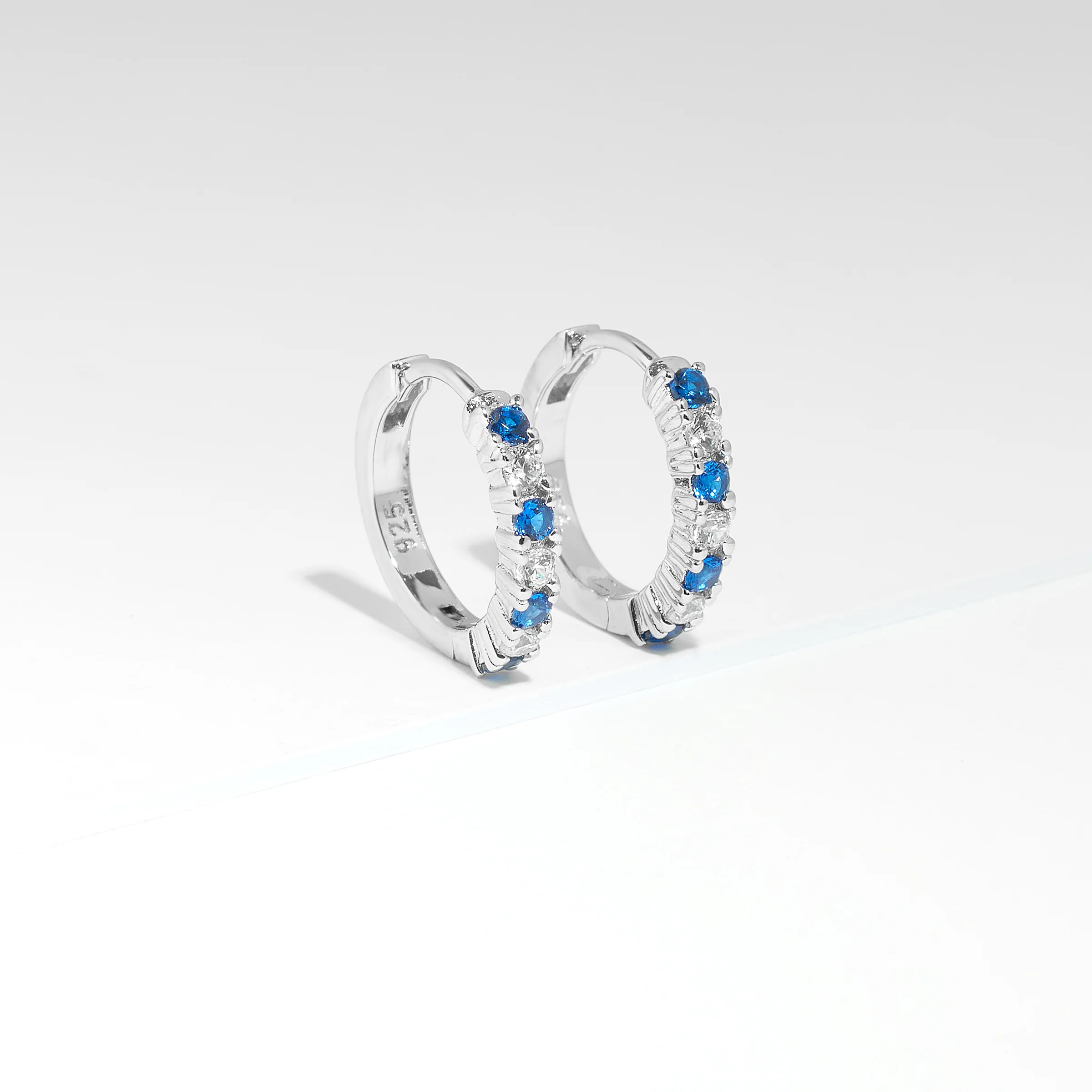 Sterling Silver Blue And White Zirconia Huggie Earrings