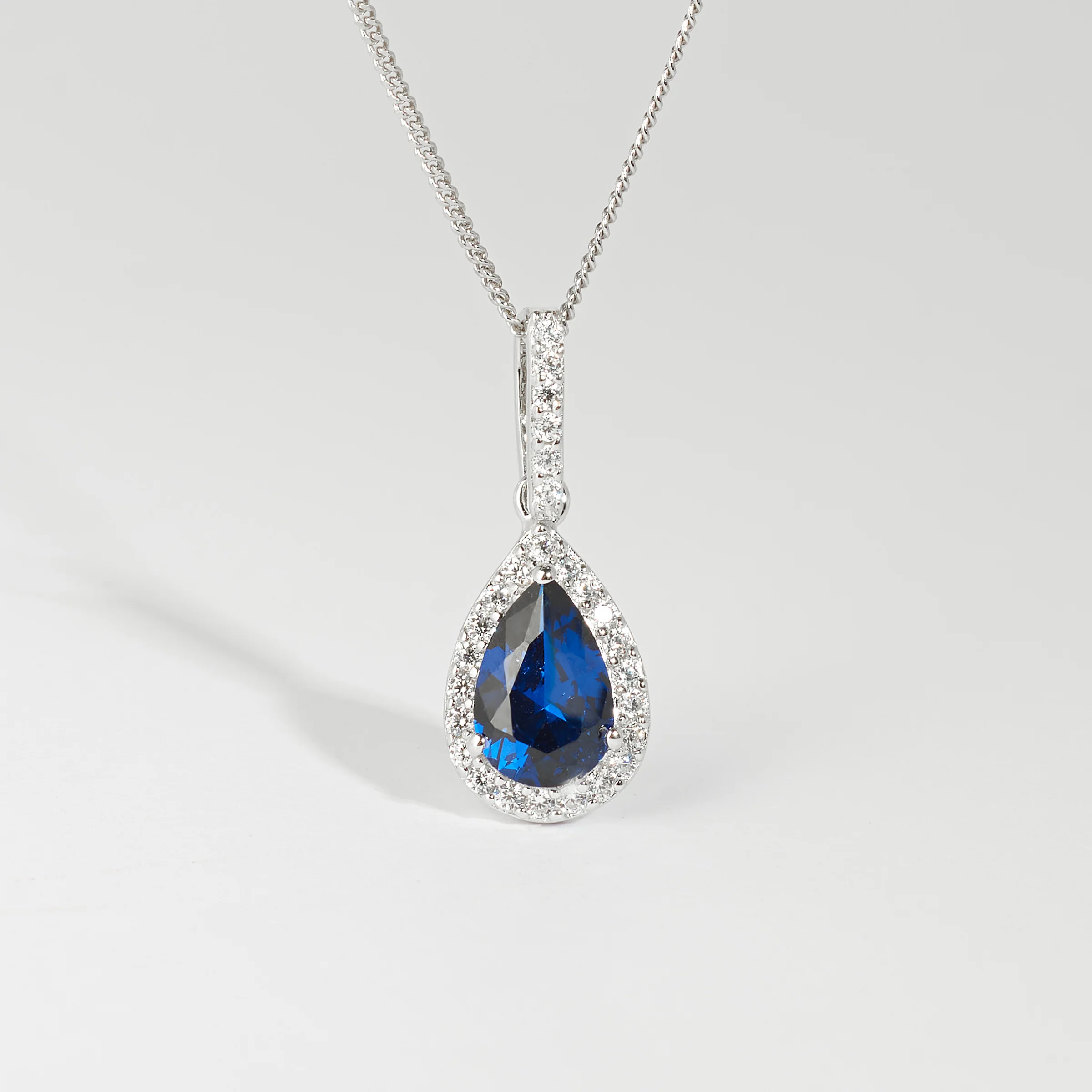 Sterling Silver Blue Pear Zirconia Halo Pendant