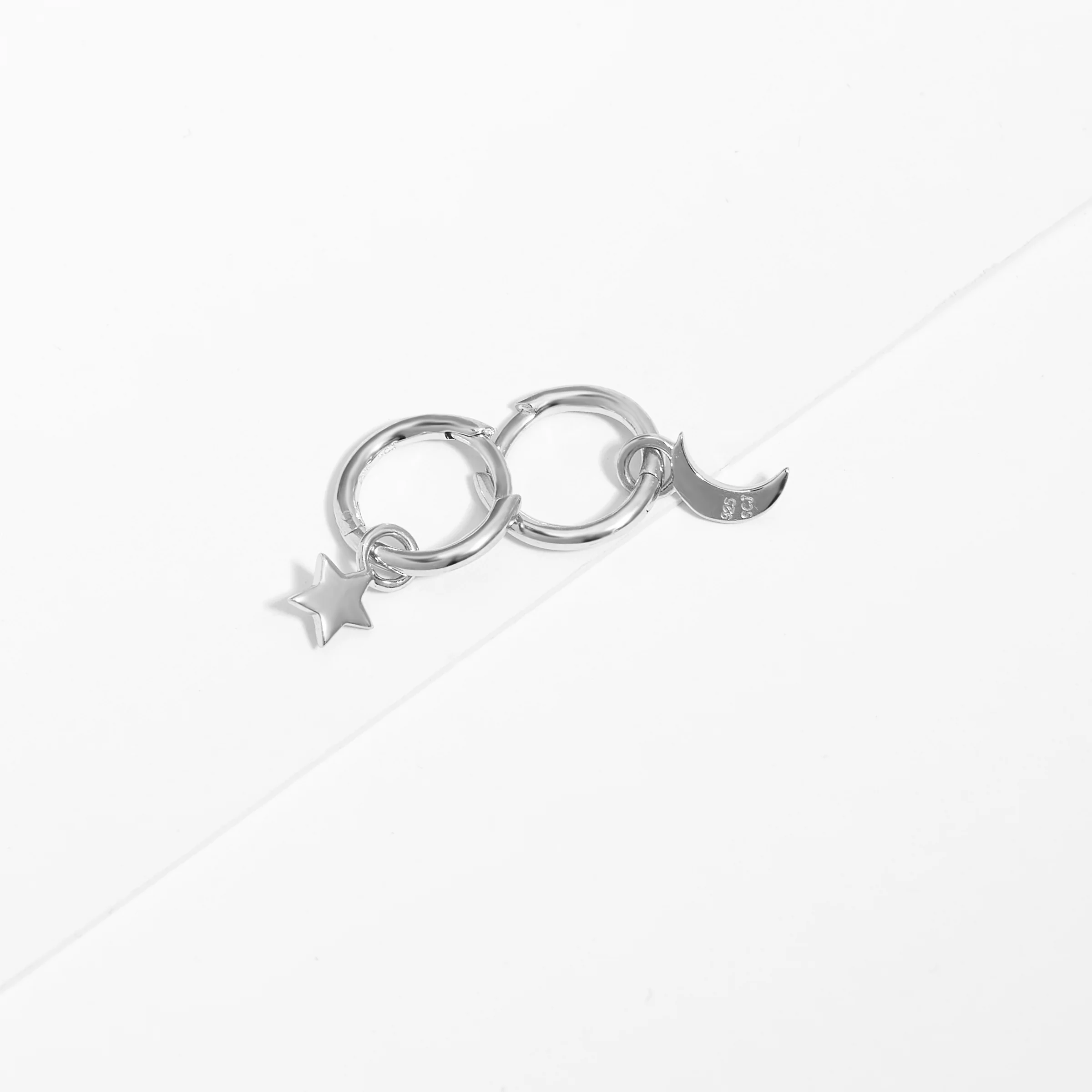 Sterling Silver Huggie Earrings With Dangling Star And Moon - Image 2